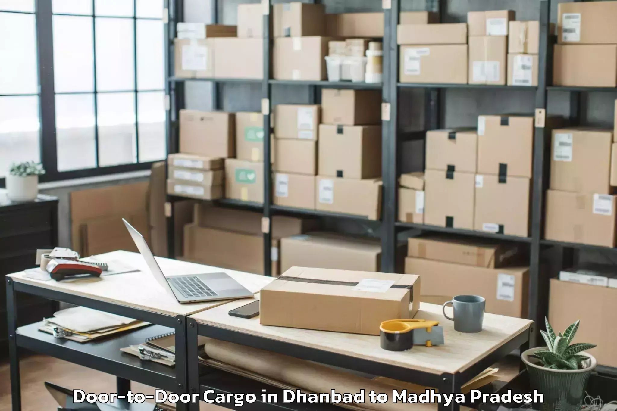 Reliable Dhanbad to Barnagar Door To Door Cargo